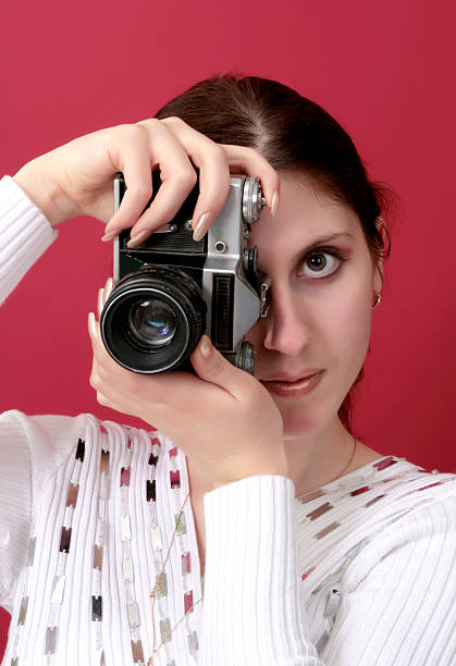 istock young woman shouting holding a camera in hand 178417816