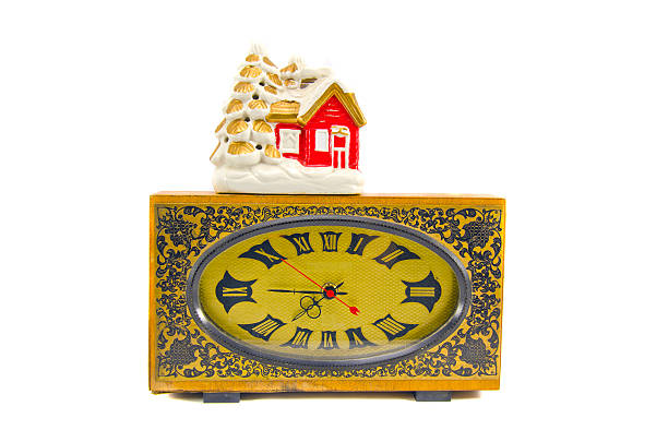 istock ancient clock and vintage Christmas house 178417929