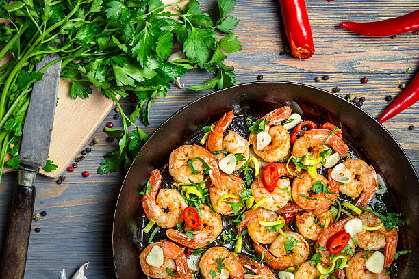 istock Shrimps fried on pan with fresh herbs 178417953