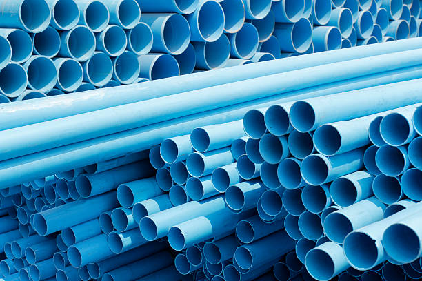 istock PVC pipes stacked in construction site 178418629