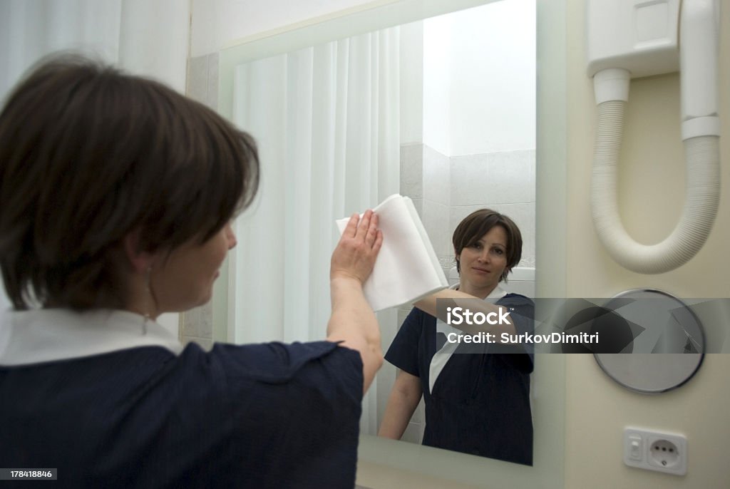 Maid at work Maid working in hotel room 30-39 Years Stock Photo