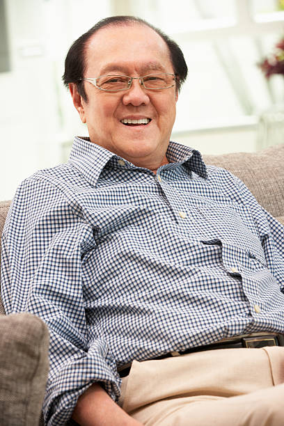istock Senior Chinese Man Relaxing On Sofa At Home 178419951