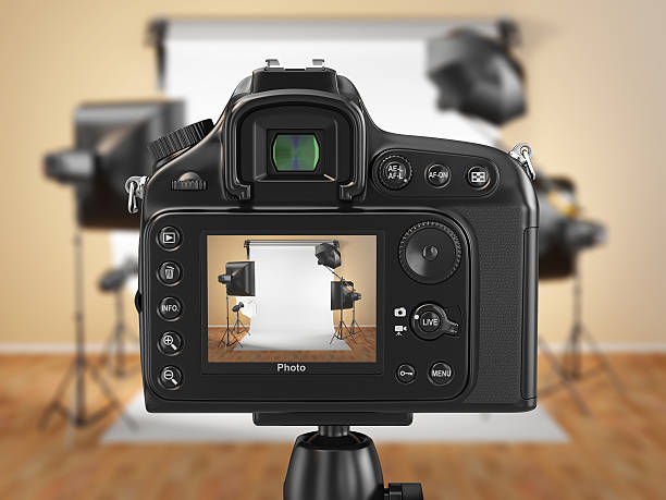 Digital photo camera in studio with softbox and flashes. Digital photo camera in studio with softbox and flashes. 3d camera photographic equipment stock pictures, royalty-free photos & images