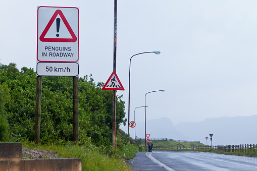 A sign in front of an empty layby on a winding section of the A9 in Scotland.