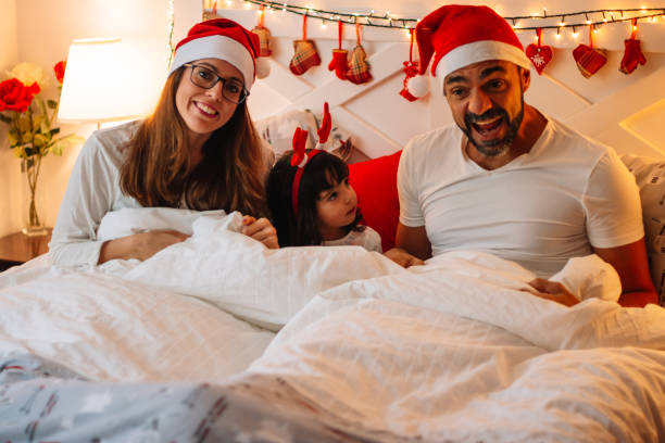 istock Family in bed dressed for Christmas 1784207192