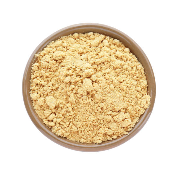istock Aromatic mustard powder in bowl on white background, top view 1784208444
