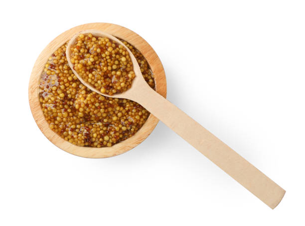istock Bowl and spoon with whole grain mustard on white background, top view 1784210095