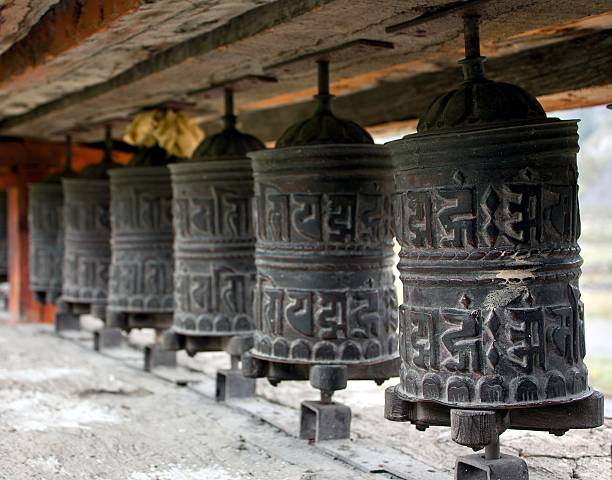 many prayer wheels many prayer wheels prayer wheel nepal kathmandu buddhism stock pictures, royalty-free photos & images