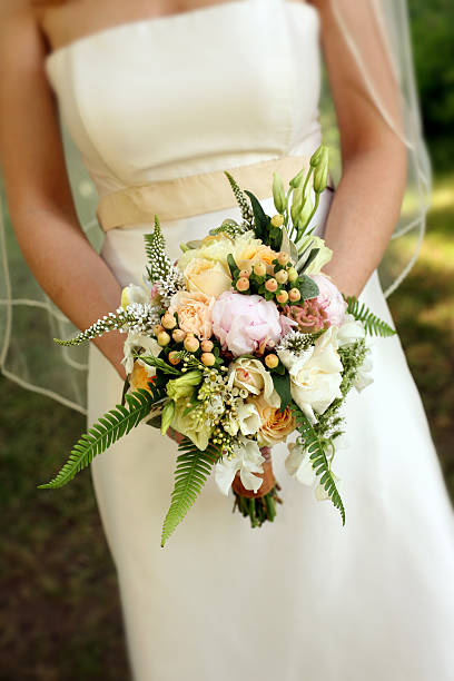 istock Bride Holding Bouquet of Flowers 178421969