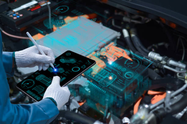 auto mechanic using a tablet wireless scanning tool to check the ecu engine system; automobile information displayed on a screen; mechanic working on cars at a garage - hybride auto stockfoto's en -beelden