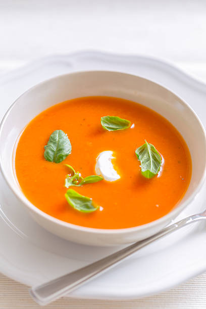 istock fresh tomato cream soup garnished with basil 178422155