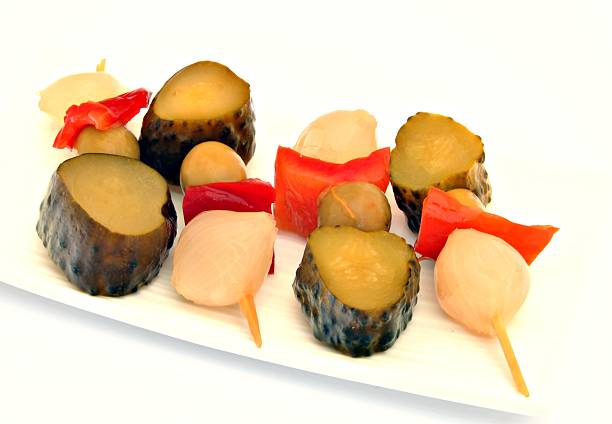 Pickles in a flags Pickles in a flags served on a plate banderilla stock pictures, royalty-free photos & images