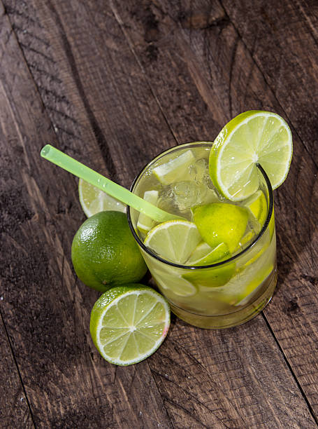 Glass with Caipirinha on wood