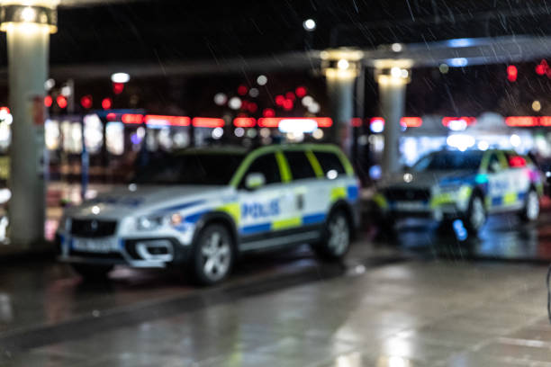 Parked swedish police vehicles out of focus.