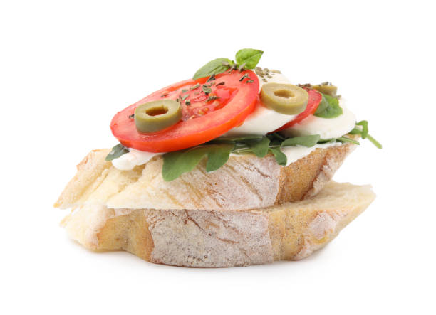 istock Tasty bruschetta with tomatoes, mozzarella and olives on white background 1784256763