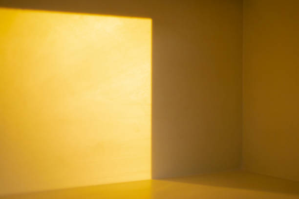 istock Light and shadow in the bright yellow room 1784257041