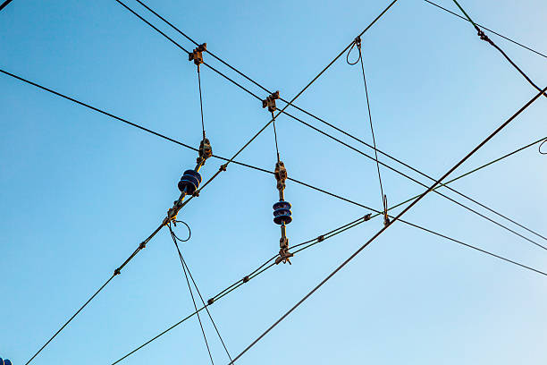 istock Railroad overhead lines against clear blue sky 178426939