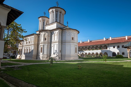 A beautiful monastery in the countryside of Romania on a sunny day