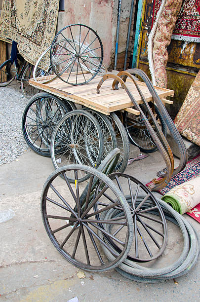 istock trishaw wheels in Delhi bazaar, India 178428060