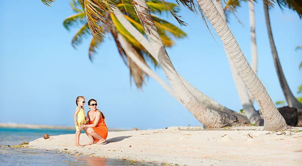 istock Mother and daughter on a beach 178428337