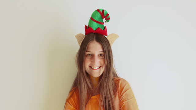 Happy Woman Wearing Elf Hat Feeling Happiness - Christmas is Coming!