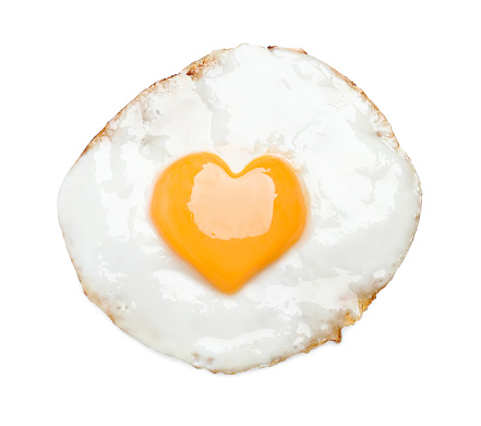 Tasty fried egg with yolk in shape of heart on white background, top view