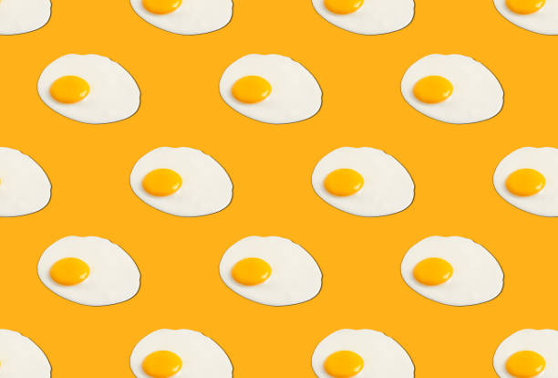 istock Many tasty fried chicken eggs on orange background 1784285397