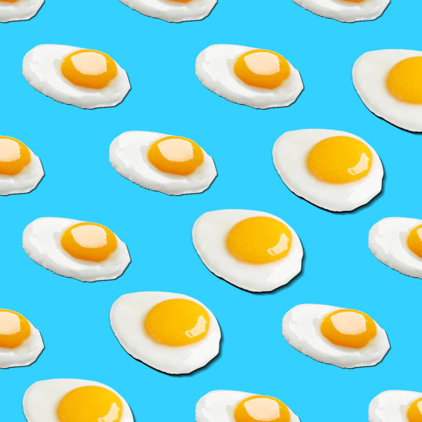 istock Many tasty fried chicken eggs on light blue background 1784285412