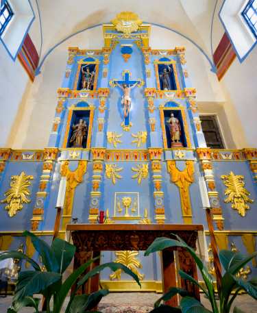 Interior view of the ornate Mission San Jose sanctuary in San Antonio, TX
