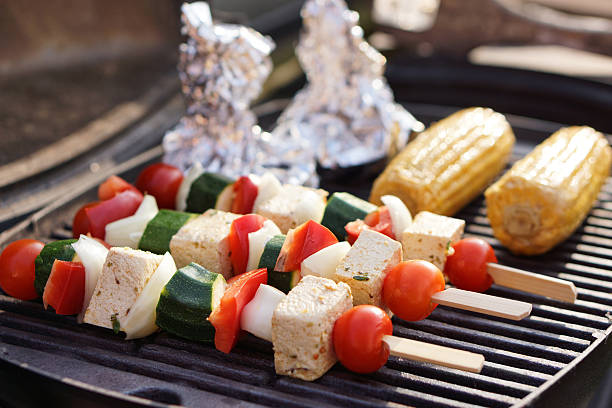 Vegetarian Barbecue,  marinated vegetables and tofu kebabs on a grill