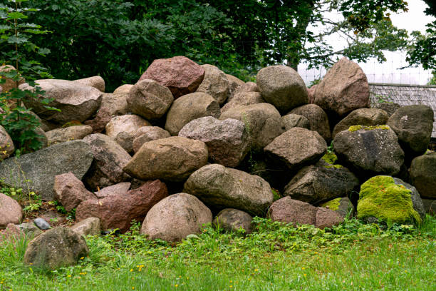 istock A pile of large granite stones collected from the field. 1784289913