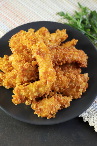 istock Baked chicken nuggets with ketchup. 1784291043