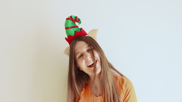 Happy Woman Wearing Elf Hat Feeling Happiness - Christmas is Coming!