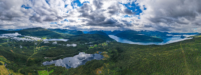 Aerial view of the reflection of the mountains in the Lakes and Fjords of Norway