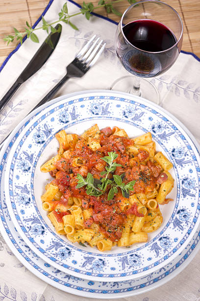 Pasta Amatriciana with red wine Pasta Amatriciana with red wine all'amatriciana stock pictures, royalty-free photos & images