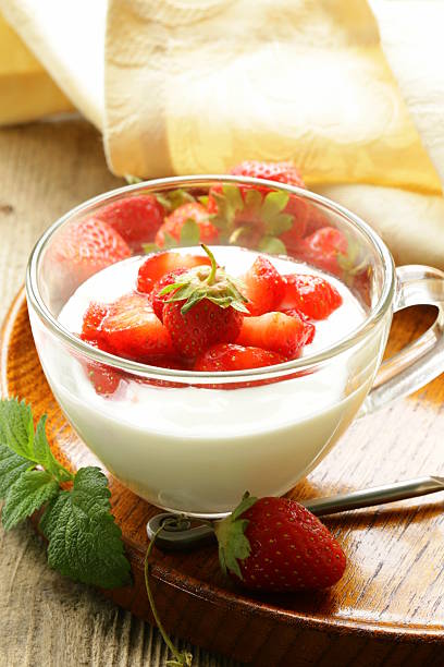 istock dairy dessert - yogurt with fresh strawberries in a glass 178429317