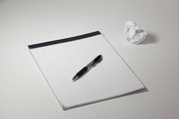 Notepad Pen and Paperball stock photo