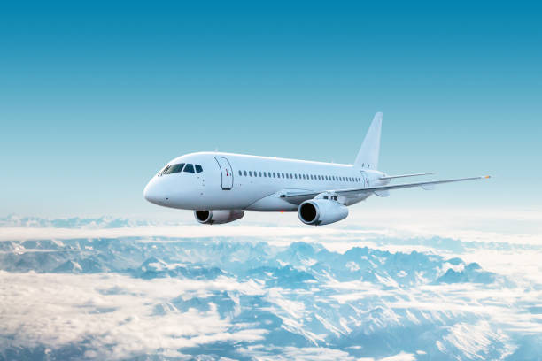 istock White modern airplane fly over snow covered mountain ranges 1784296011