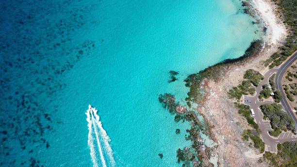 istock Tranquil beach with pristine sand and a calm turquoise-colored sea in the background 1784296583