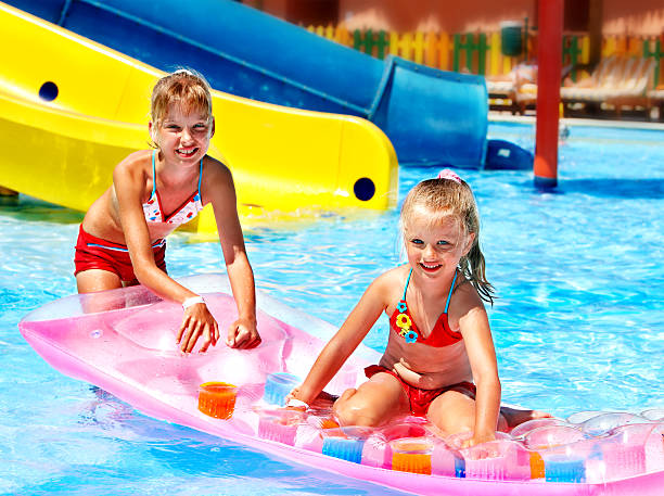 istock Child on water slide at aquapark. 178429807