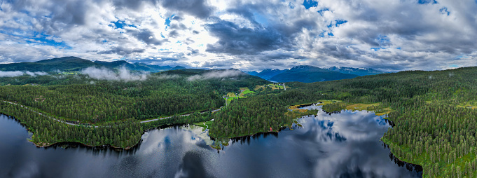 Aerial view of the reflection of the mountains in the Lakes and Fjords of Norway