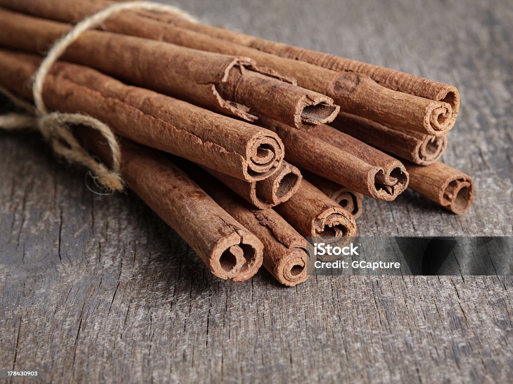 cinnamon sticks on old wooden table cinnamon sticks on old wooden table, selective focus Brown Stock Photo