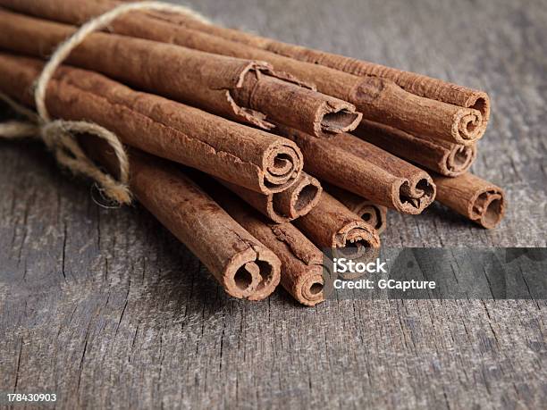 Cinnamon Sticks On Old Wooden Table Stock Photo - Download Image Now - Brown, Christmas, Cinnamon