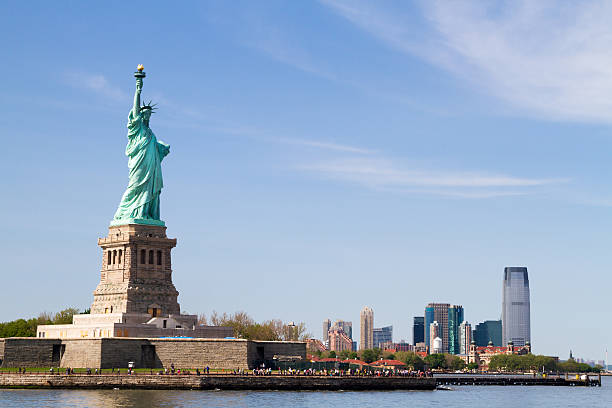 istock Statue of Liberty, and Manhattan Skyline behind it 178431071