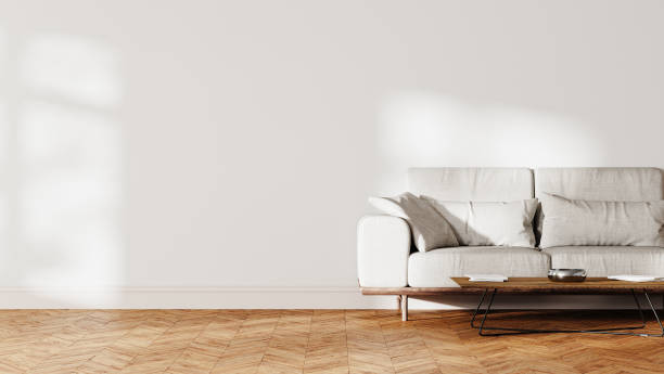 istock half empty living room interior mock up, gray sofa near white wall with sunlight, 3d rendering 1784312163