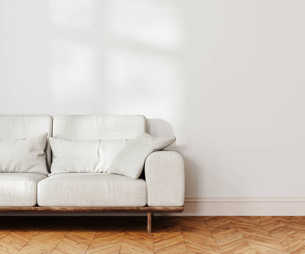 istock living room interior mock up, gray sofa near white wall with sunlight, 3d rendering 1784313283
