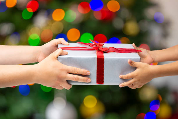istock mother giving christmas present to her child 1784317259