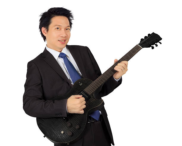 istock Asian business man with a black guitar 178432001