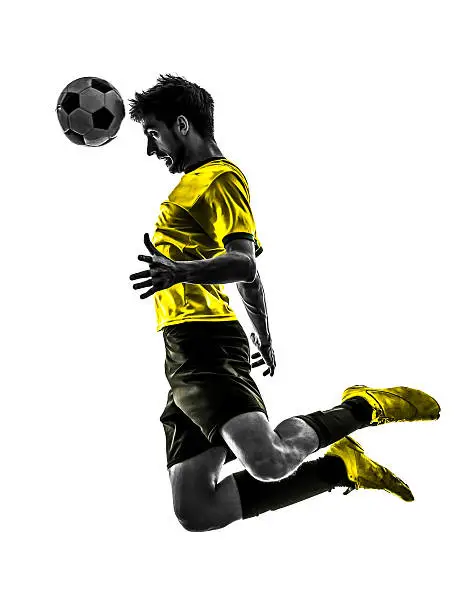 Photo of Brazilian soccer player heading the ball while jumping