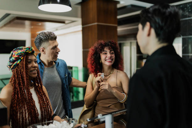 istock Friends talking with the receptionist at hotel 1784323402
